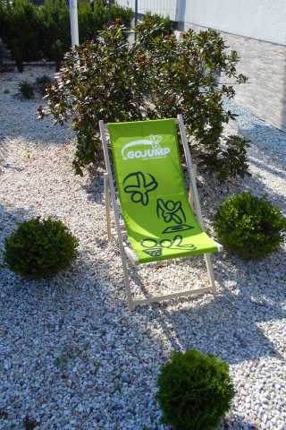 Tumbonas con la impresión personalizada producidas por Reacción Banderas Publicitarias